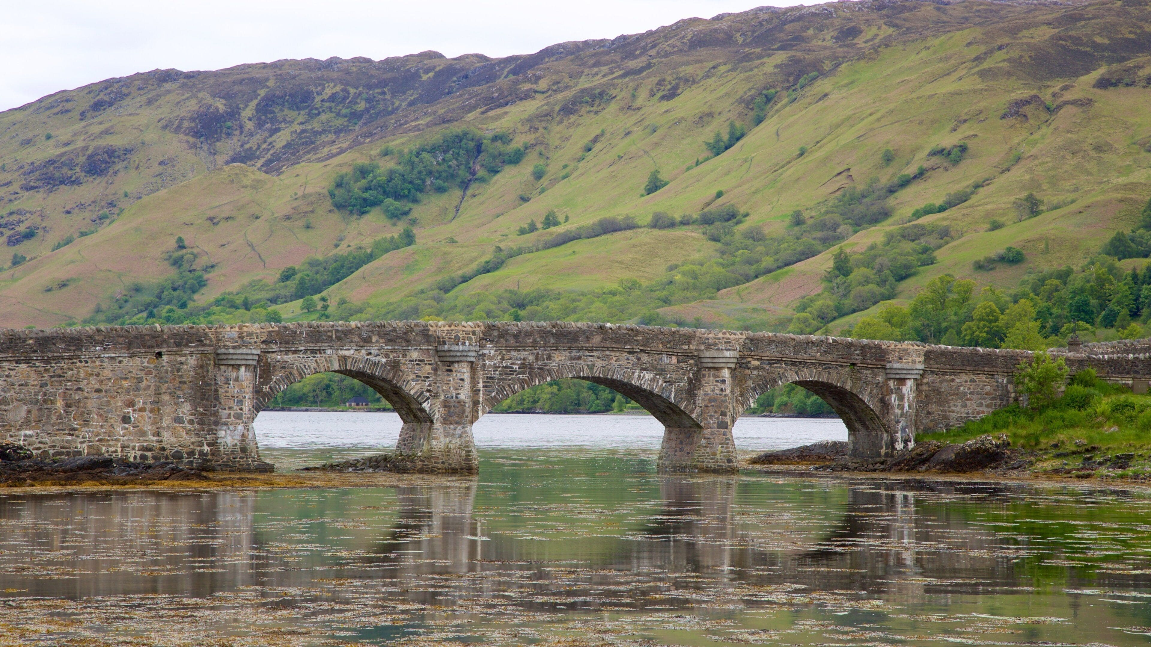 Eilean Donan Castle showing heritage elements, a bridge and a river or creek