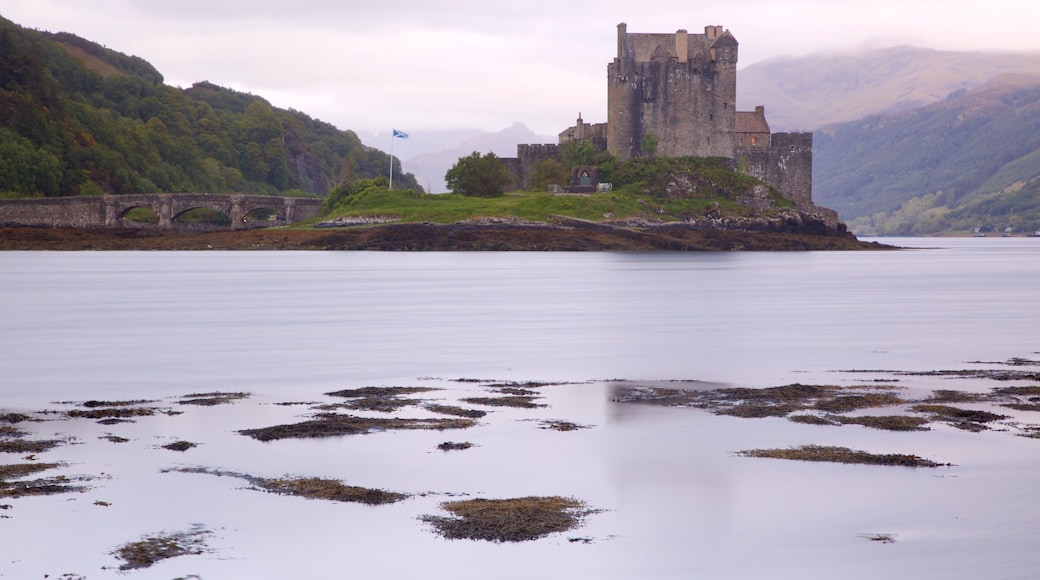 Eilean Donan Castle featuring a bridge, a river or creek and chateau or palace