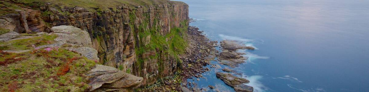 Dunnet Head Lighthouse which includes rugged coastline