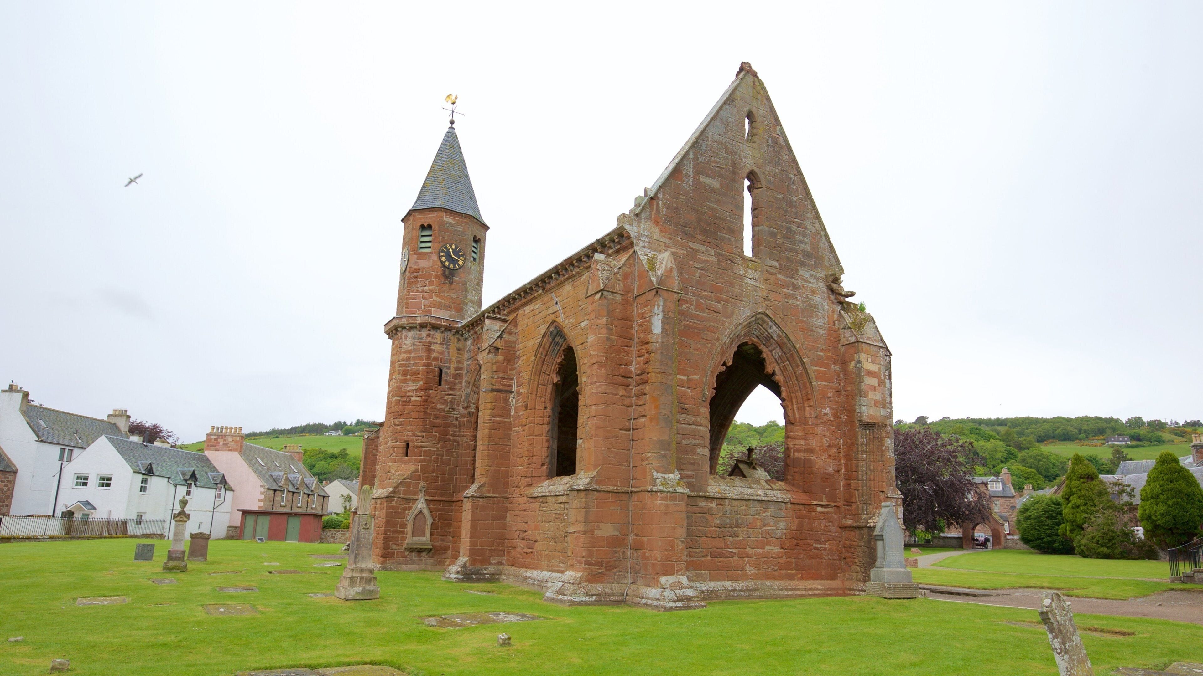 A historic church with a clock tower and arched windows.
