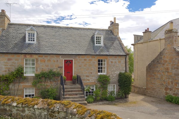 Dornoch Cathedral showing a house