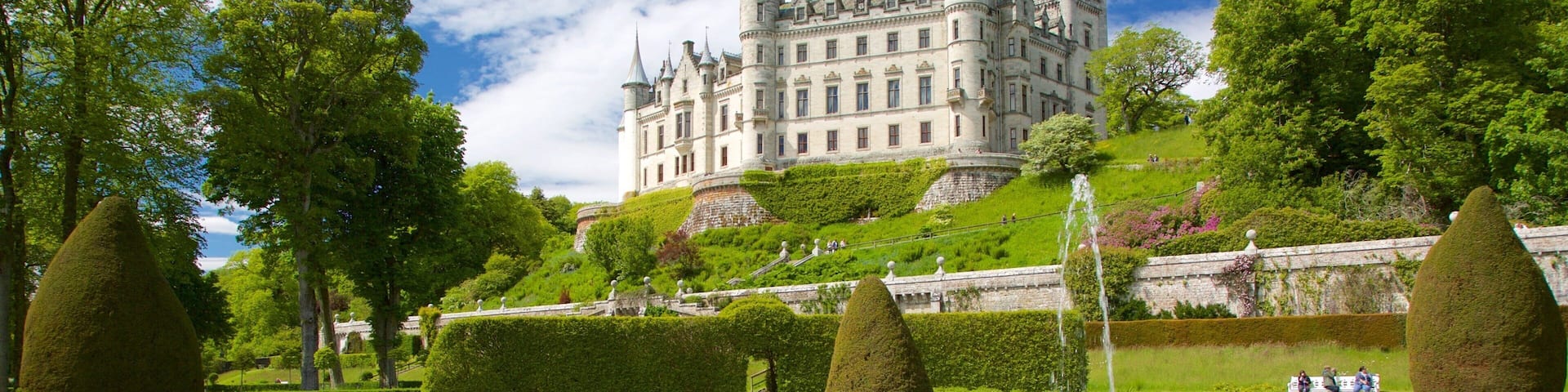 Castillo de Dunrobin ofreciendo una fuente, un jardín y un castillo