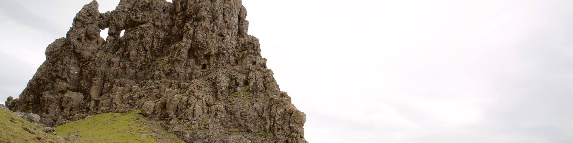 Old Man of Storr which includes tranquil scenes, a monument and a lake or waterhole