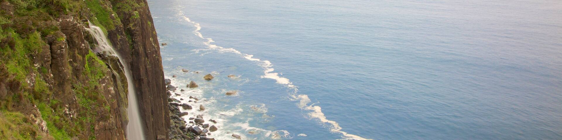 Kilt Rock showing rocky coastline and a cascade