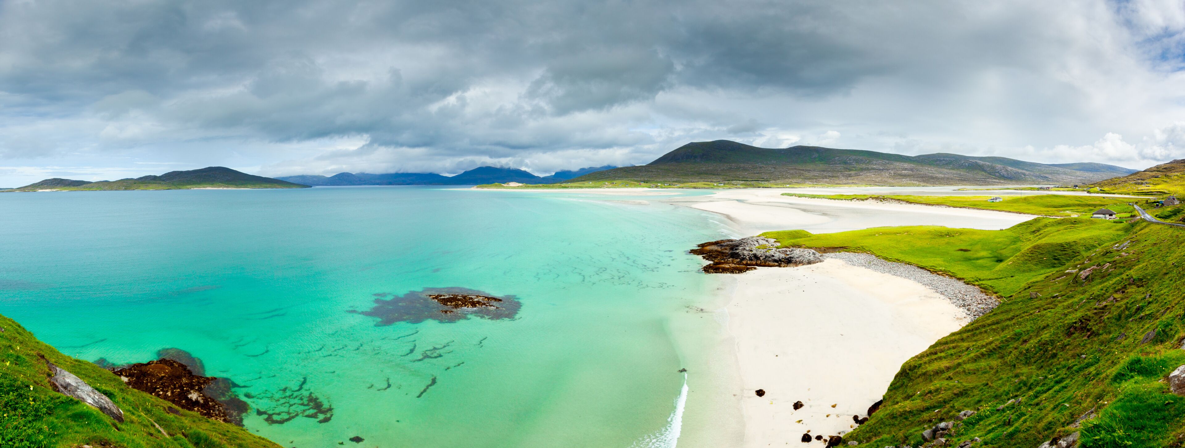 Panoramic view of Luskentyre white beaches under dramatic sky, Isle of Harris, Scotland