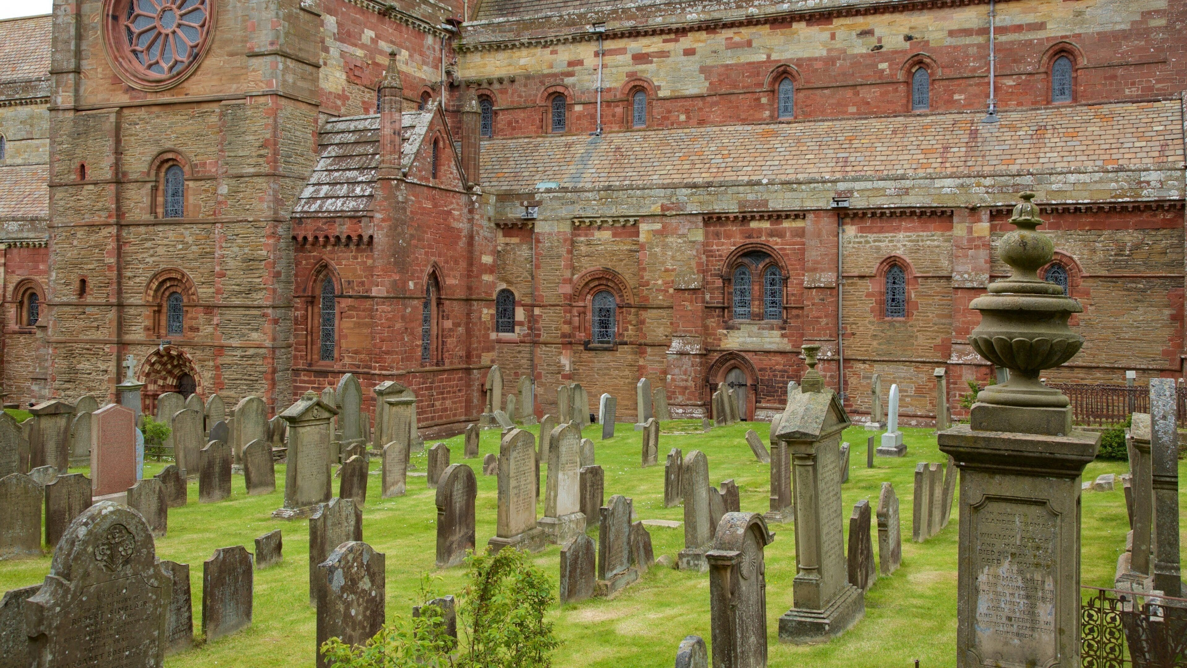 St. Magnus Cathedral which includes a cemetery, heritage architecture and a church or cathedral