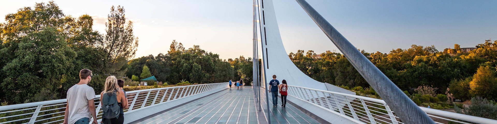 Sundial Bridge showing a sunset and a bridge as well as a couple