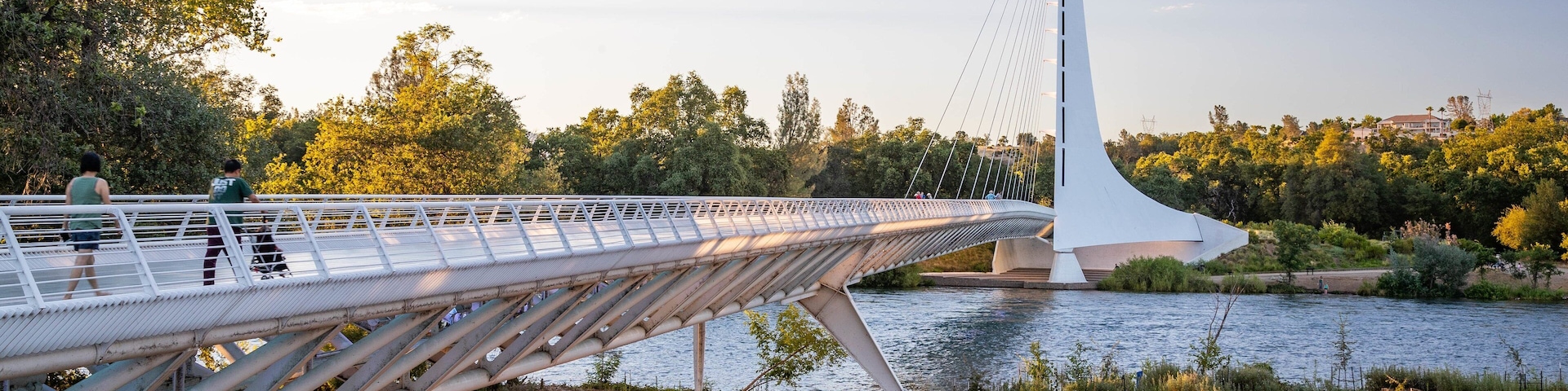 Sundial Bridge featuring a sunset, a bridge and a lake or waterhole