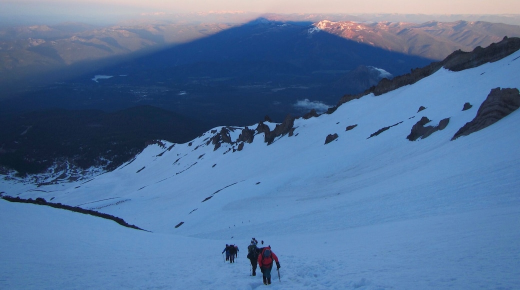 Shadow of Mt. Shasta June 2016 and a few climbers heading to the summit. It is approximately 10 miles up and just over 7,000’ in elevation gain. Started at Bunny Flat and camped at Helen Lake. We were fortunate that the weather allowed us to summit. The climbers the day before were not so fortunate due to the weather. It was a little cold due to the wind chill factor from the winds. Try to avoid weekends due to the crowds. It is a very special place and a sense of accomplishment when one summits this mountain.
Note: We saw a CHP helicopter land at Helen Lake to pick up an injured climber. Remember to take your crampons off before glissading. Enjoy your hike and have fun!
