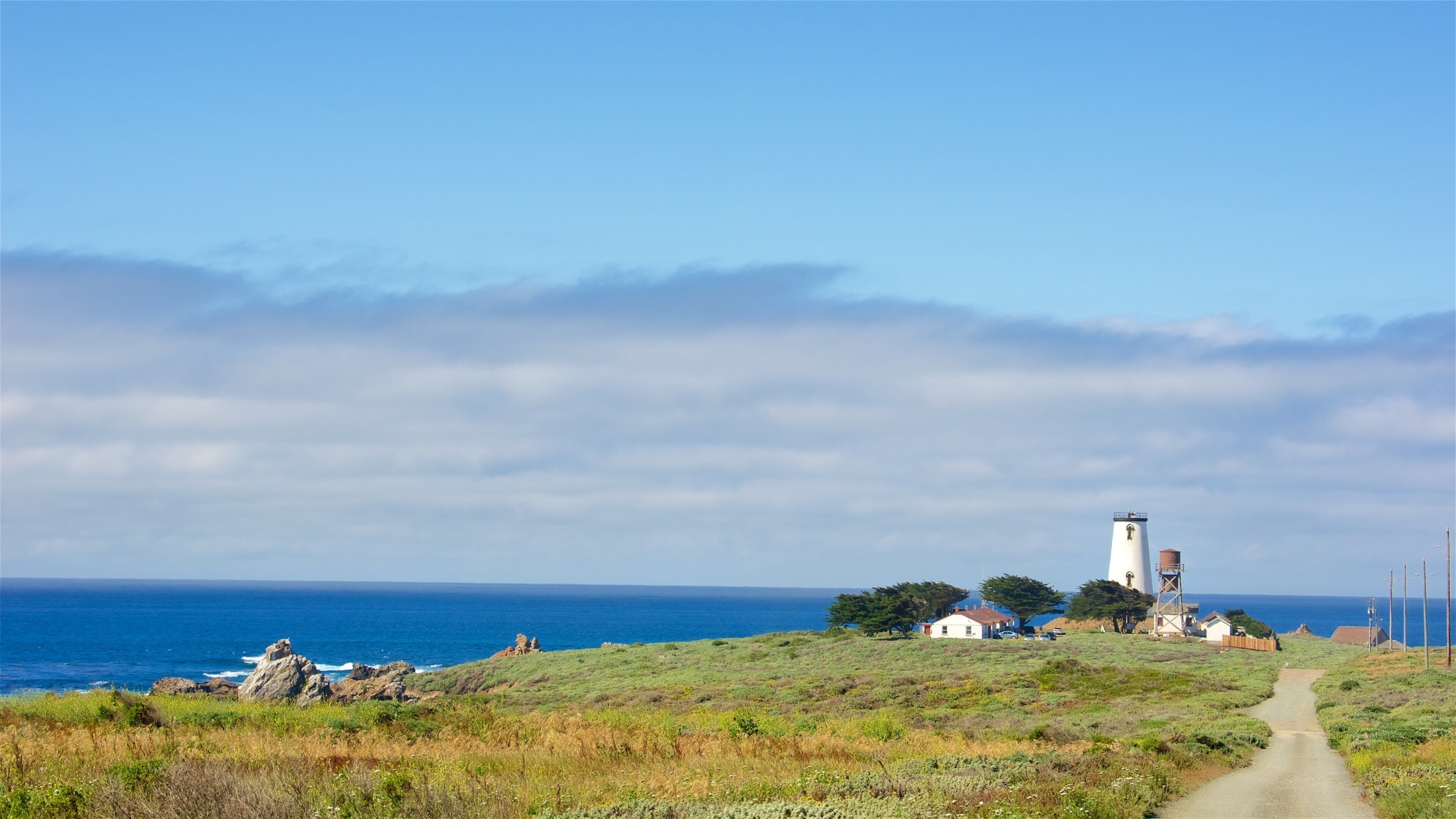 Piedras Blancas Lighthouse which includes tranquil scenes and general coastal views