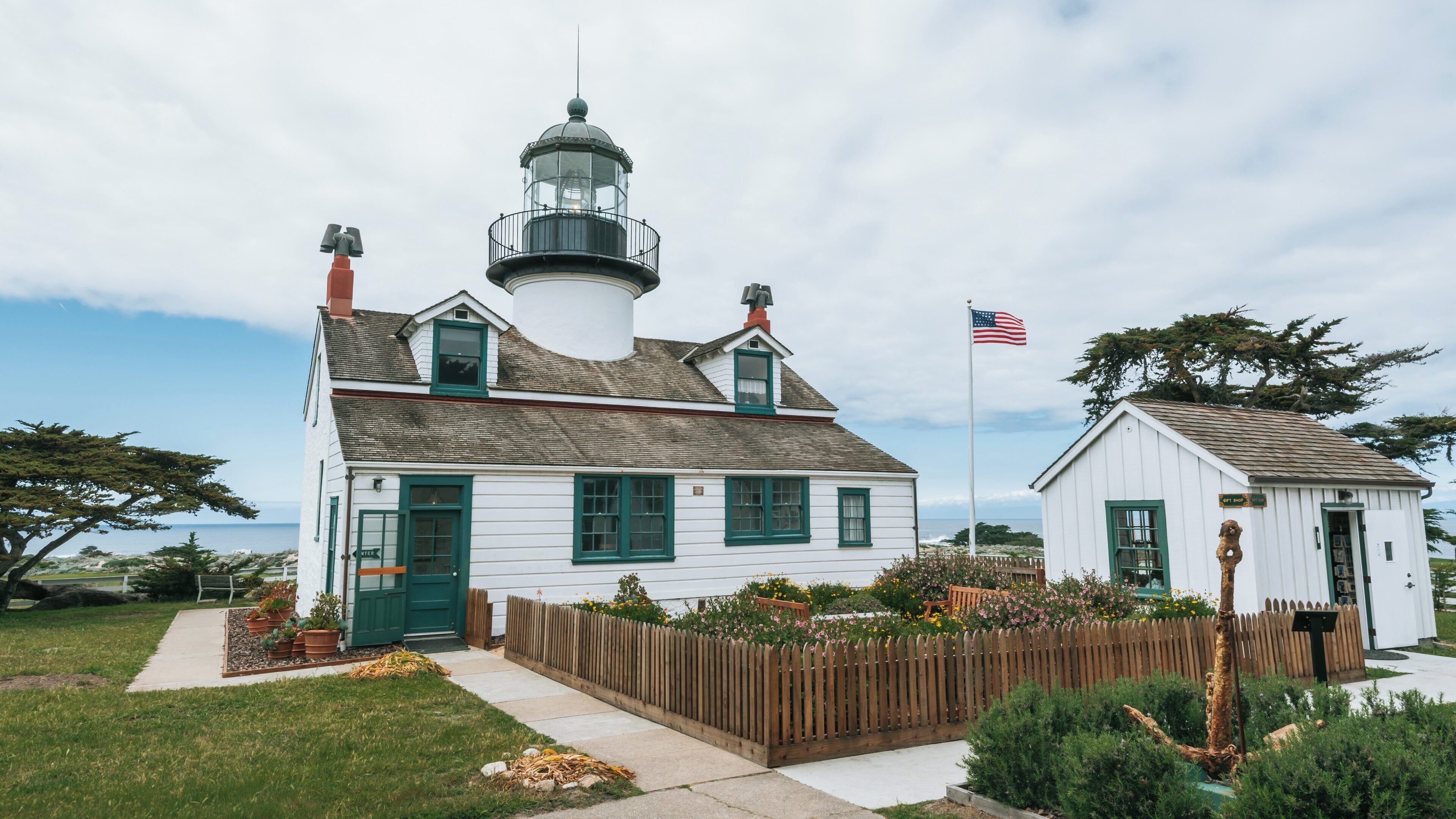 Point Pinos Lighthouse stands tall amidst Monterey's coastal beauty, showcasing a rich maritime history in California