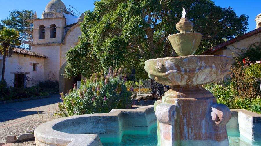 Carmel Mission Basilica featuring a garden, heritage architecture and a bay or harbor