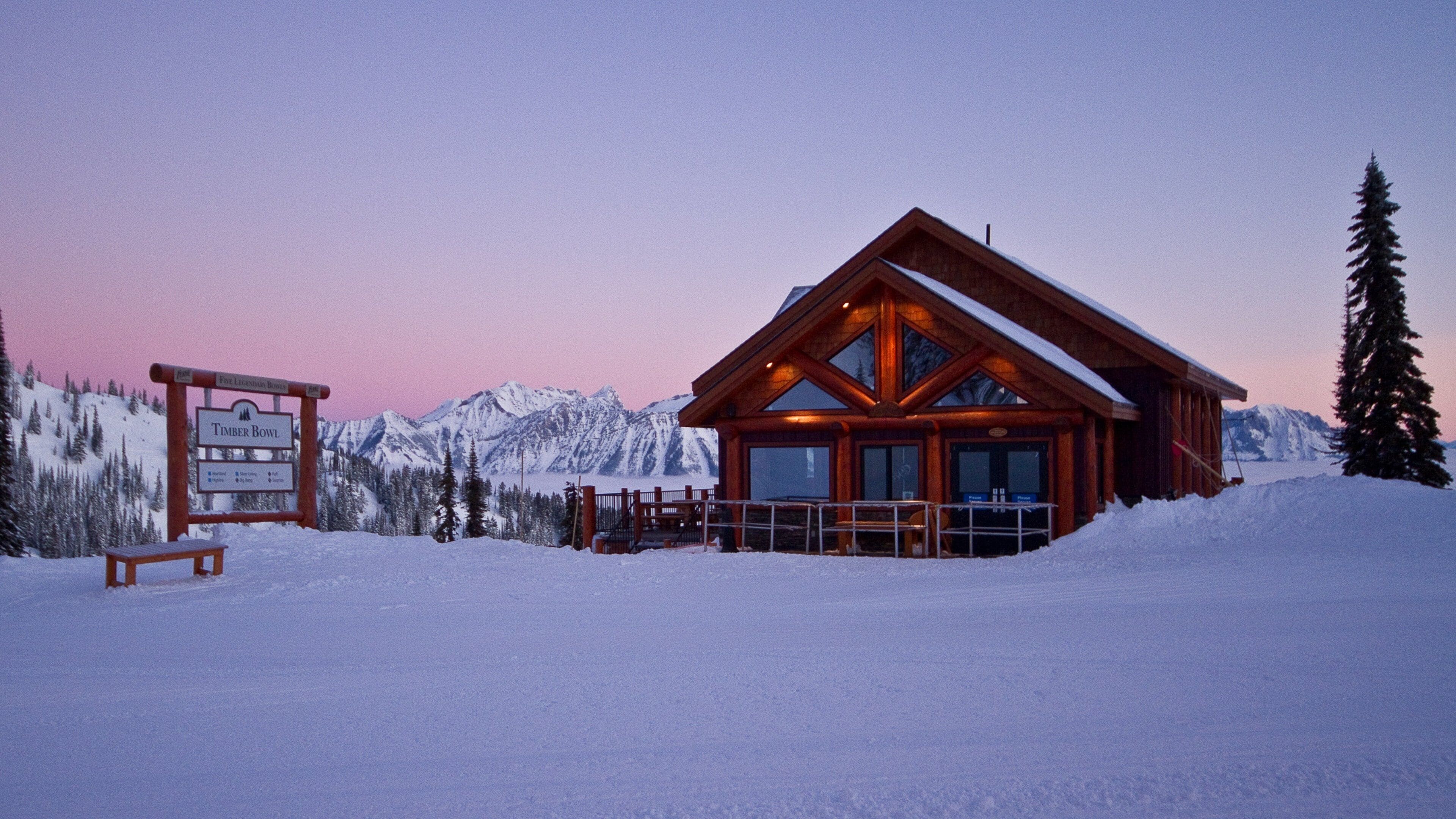 Fernie Alpine Resort featuring a sunset, a house and snow