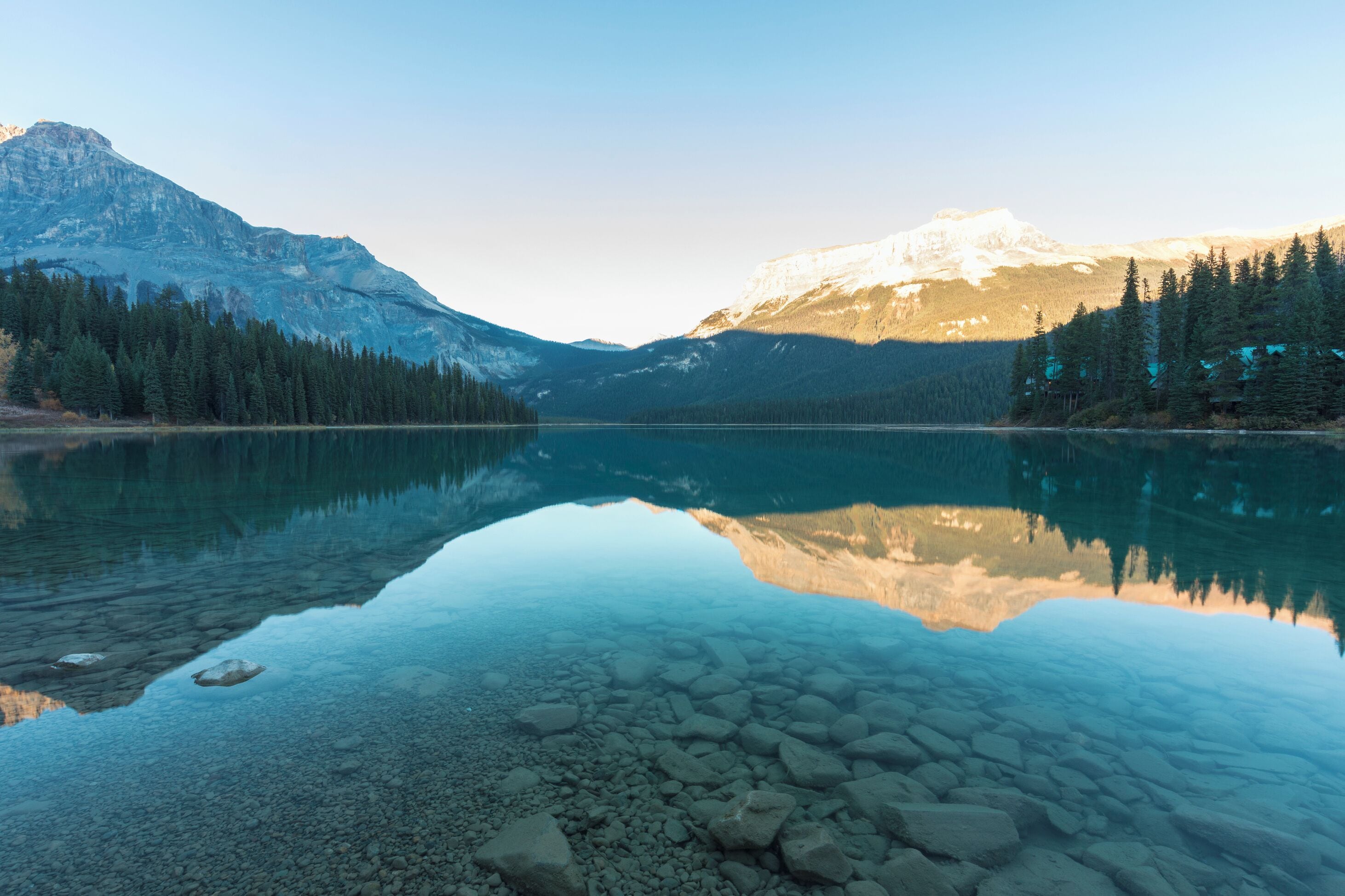 Mountains reflected in a clear water lake. Emerald Lake, Yoho National Park, Canada