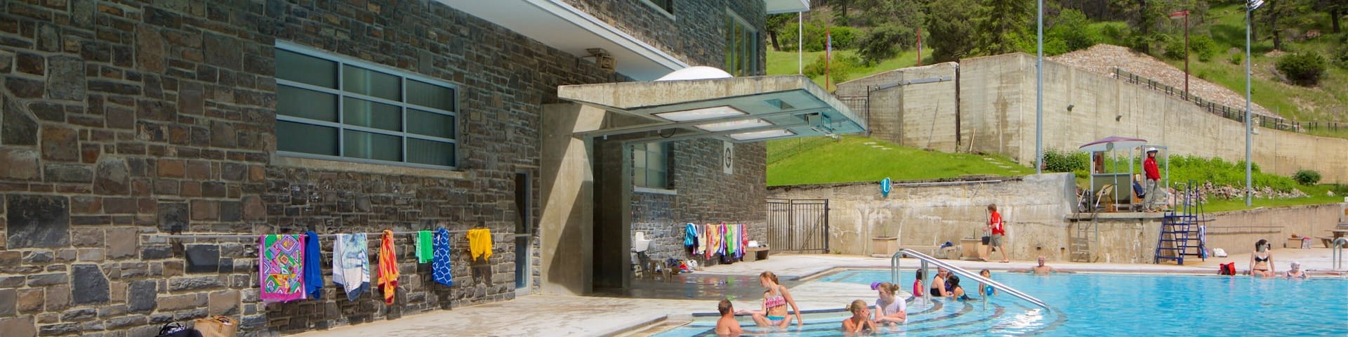 Kootenay National Park showing a pool and swimming as well as a small group of people