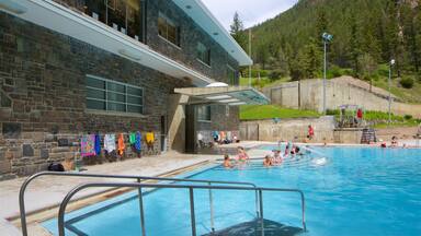 Kootenay National Park showing a pool and swimming as well as a small group of people