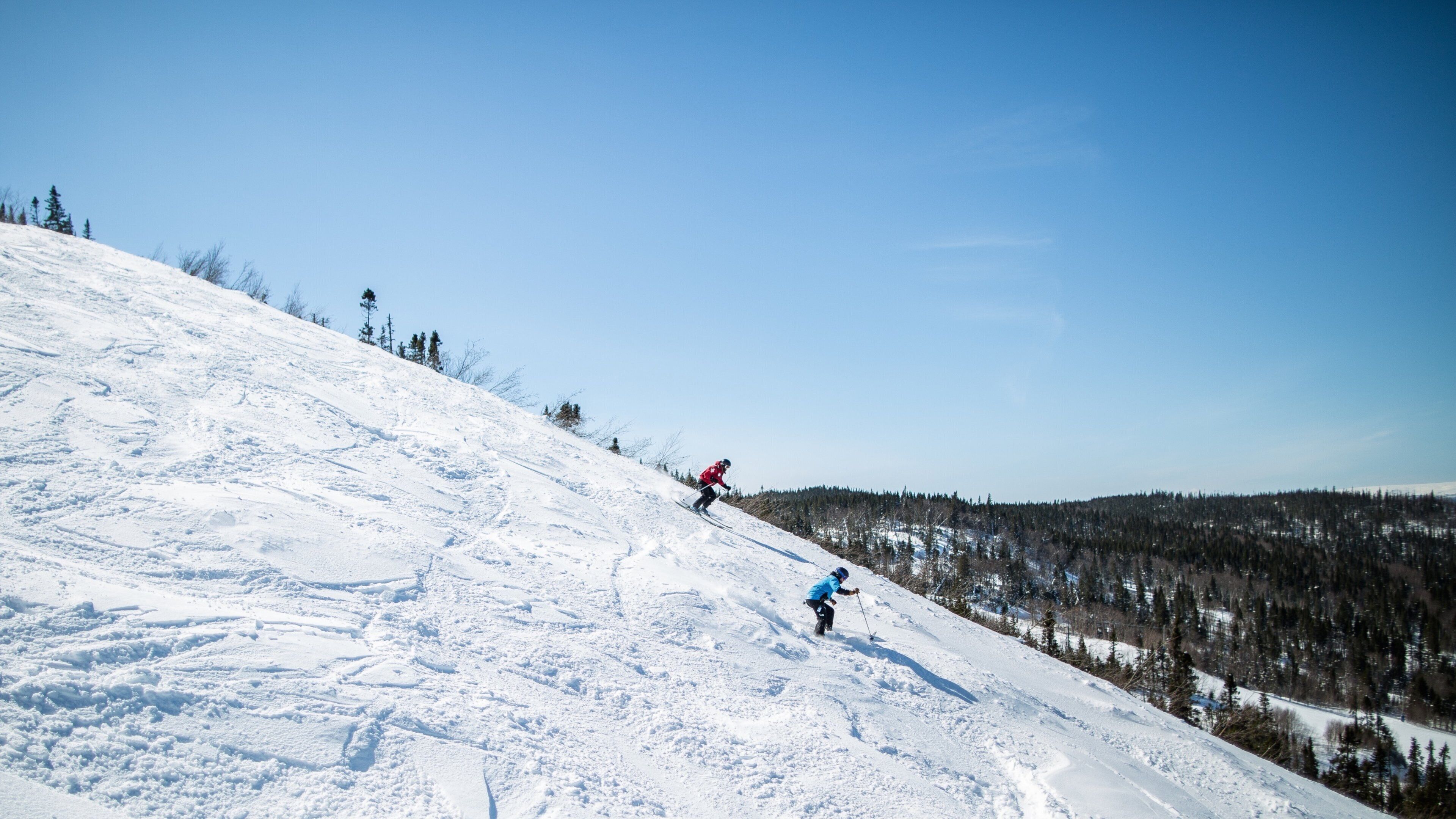 Marble Mountain featuring snow skiing and snow as well as a small group of people