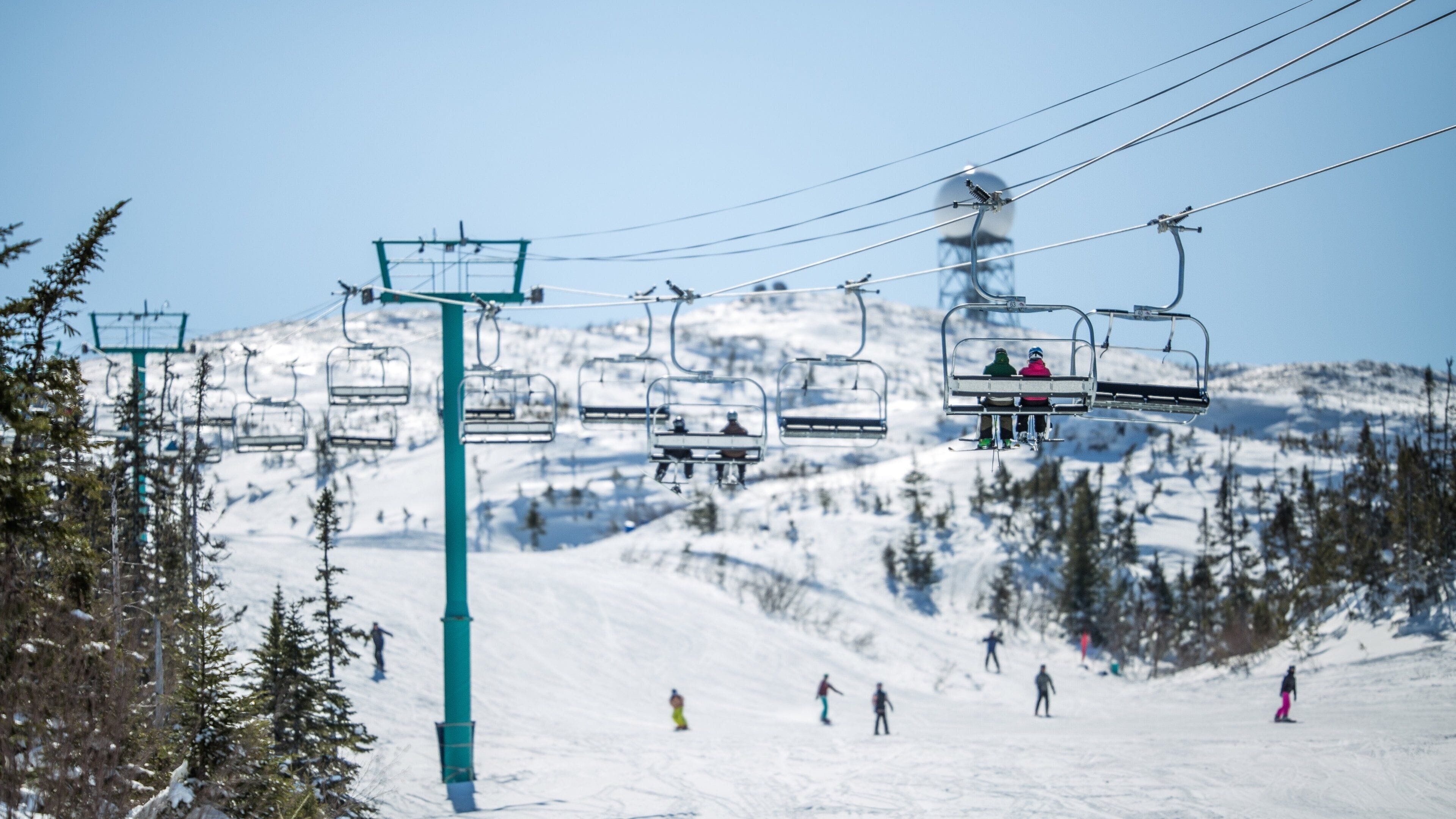 Marble Mountain featuring a gondola, snow and snow skiing