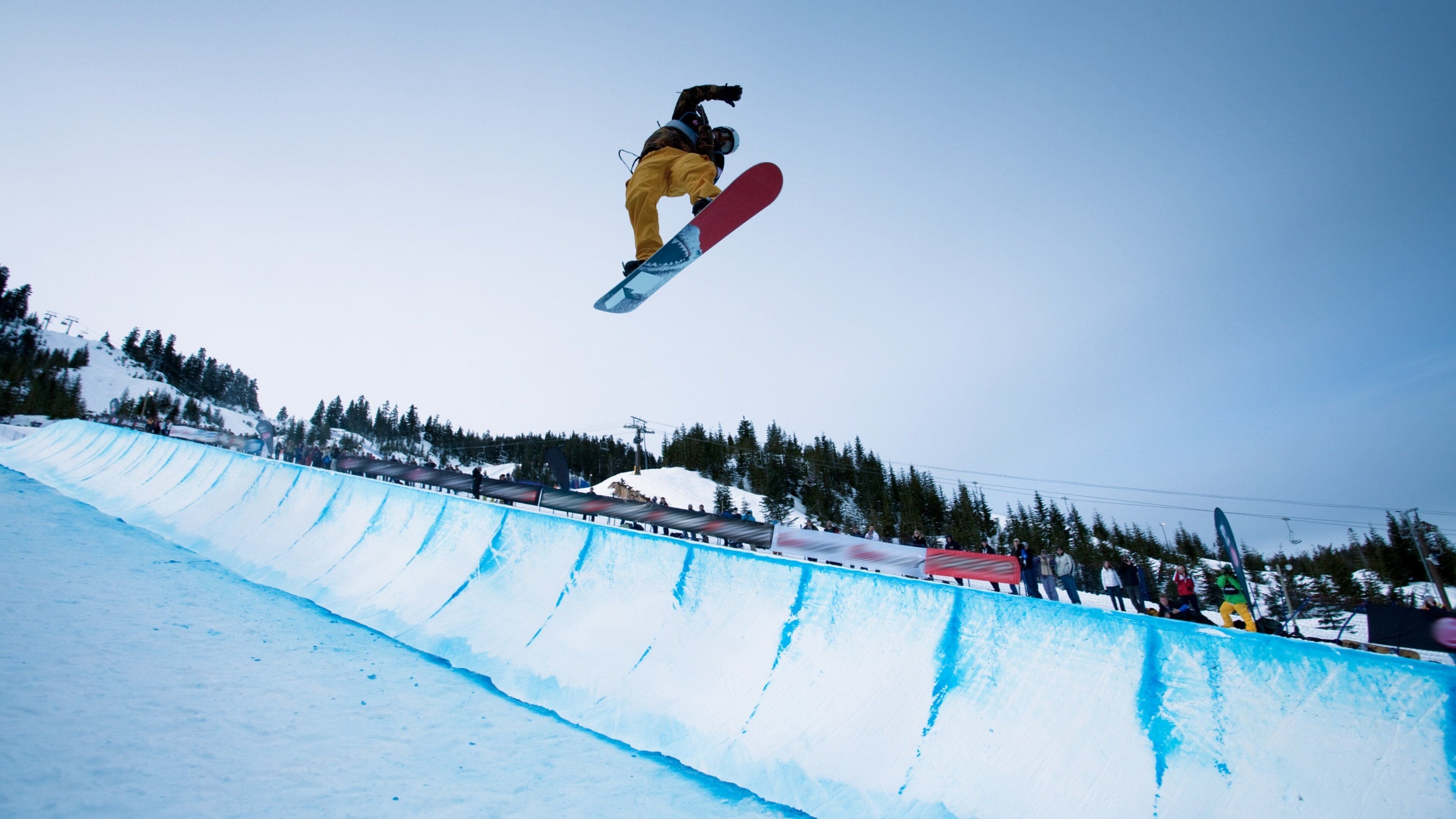 Snowboarder performs mid-air trick at Cypress Mountain in West Vancouver, British Columbia, during winter sports season