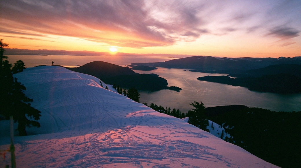 Cypress Mountain featuring a sunset, mountains and snow