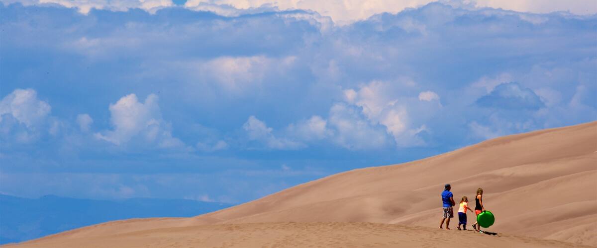 Great Sand Dunes National Park which includes desert views as well as a family