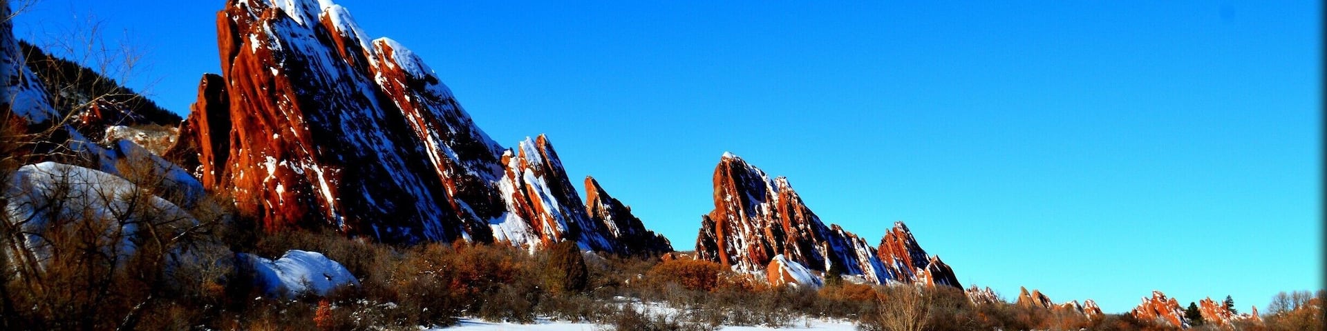 #BestOf5
This park is completely breathtaking year round. There are different paths with varying difficulties.The gorgeous red rock formations jut out all around you, making for an enchanting hike. A seven dollar entrance fee for the day, and no dogs allowed. Well worth the very short drive up from Denver.
The stark contrast of the red rocks and the white snow makes for a colorful hike.