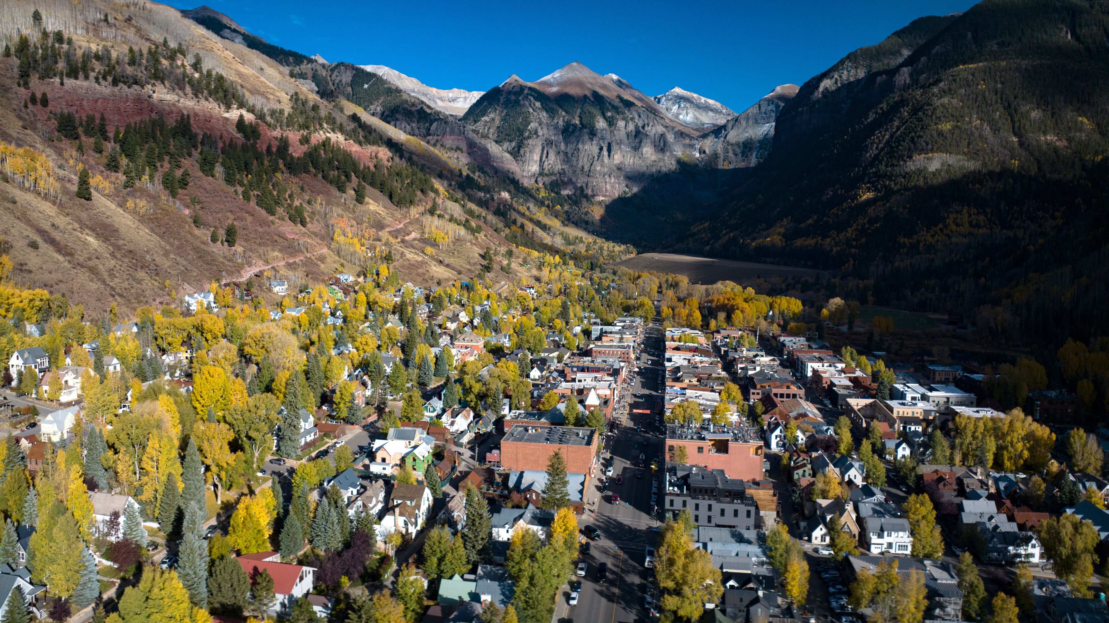 OCTOBER 14, 2023 - TELLURIDE COLORADO, USA - aerial view of Main Street old western ski town of Telluride in autumn color surrounded by mountains