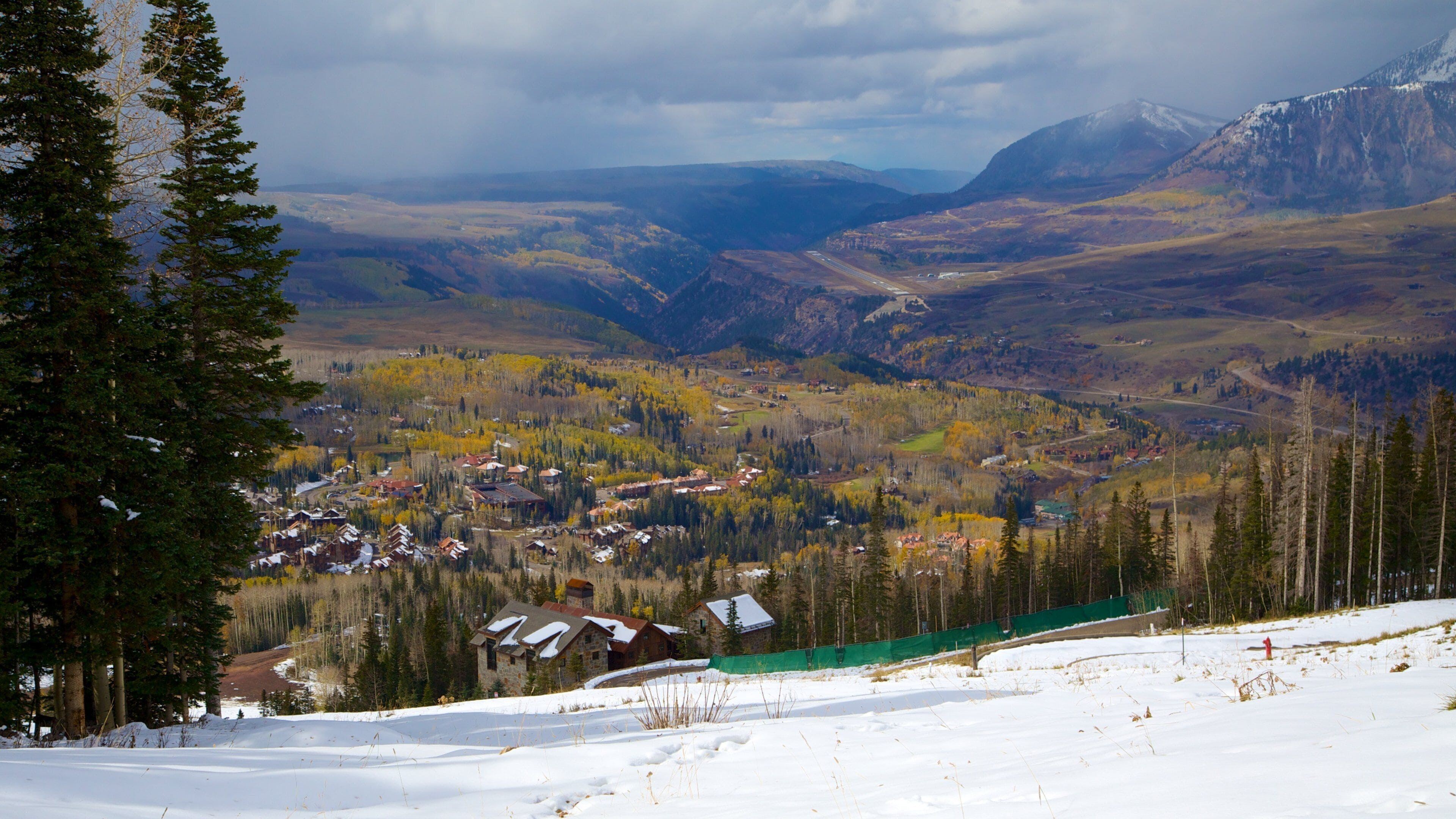 Telluride Ski Resort featuring snow, mountains and a small town or village