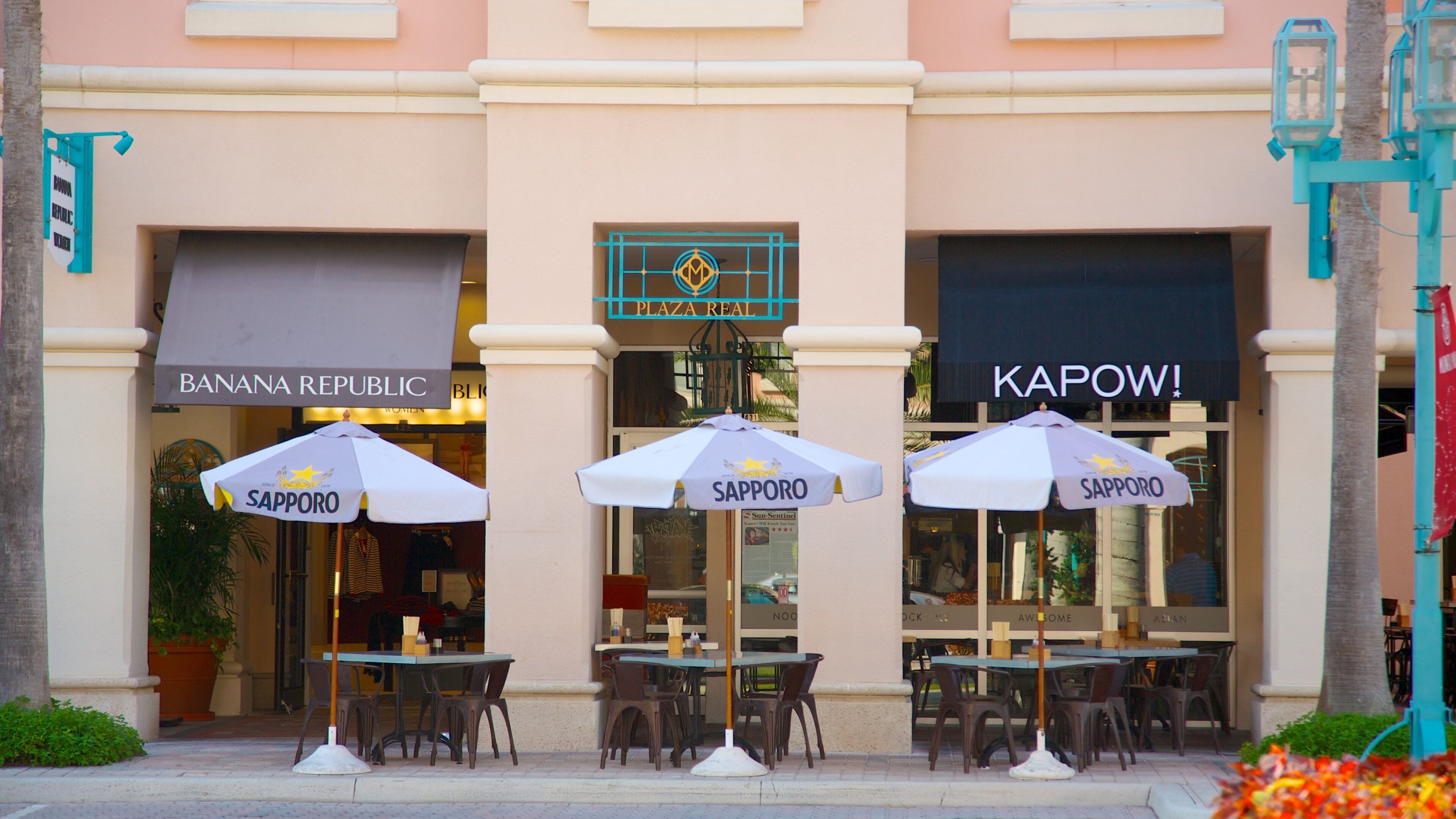 Shopping and dining at Mizner Park in Boca Raton, Florida, showcasing outdoor cafes and retail shops