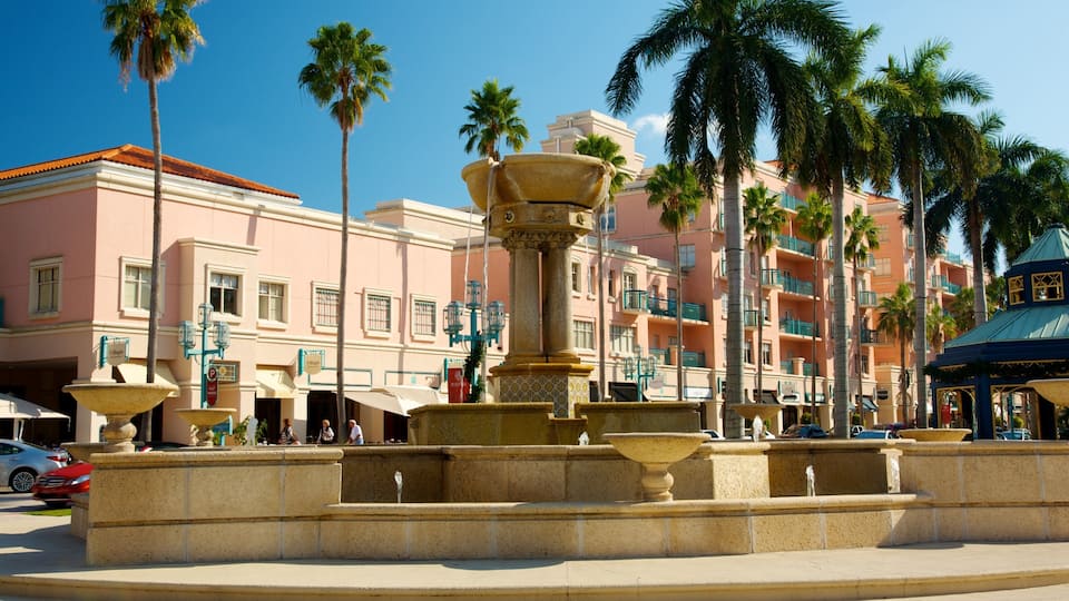 Exploring Mizner Park in Boca Raton with vibrant palm trees and a beautiful fountain on a sunny day