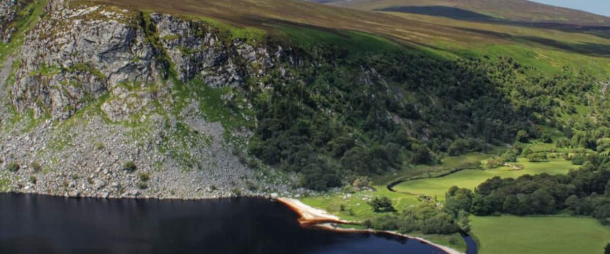 Nestled in the Wicklow Mountains of Ireland, Lough Tay is better known as Guinness Lake. The jet black appearance of the water combined with the white sand shores appearing to be froth resembles a nice cold pint.
Follow the motorway up for a couple of nice viewpoints of lough.
