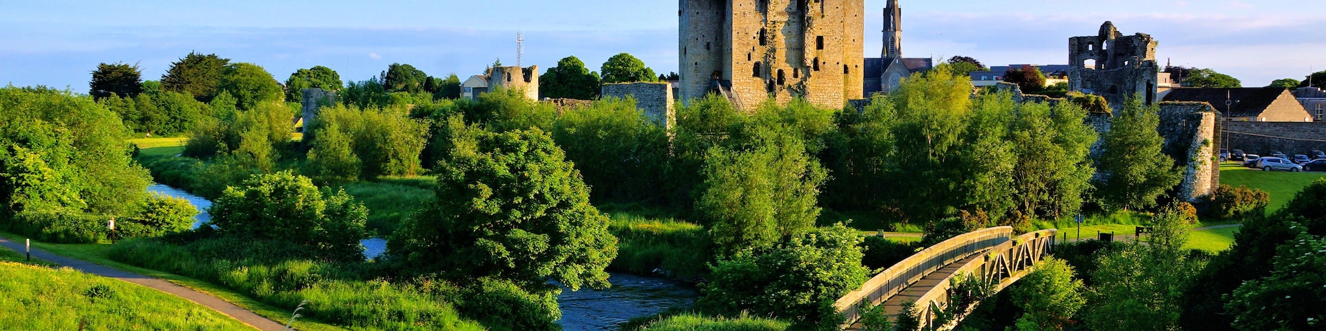 Historic Trim Castle with foot bridge. Late day light, County Meath, Ireland