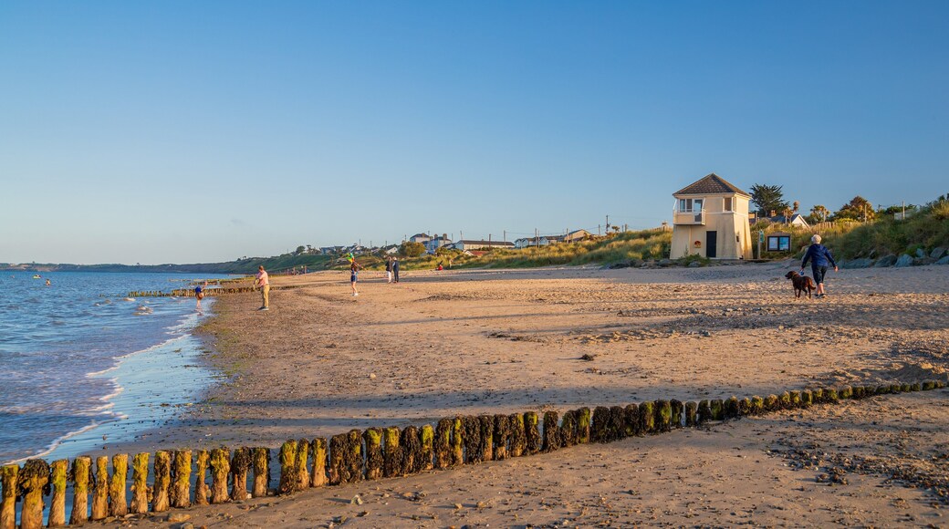 Rosslare Beach which includes general coastal views, a beach and a sunset