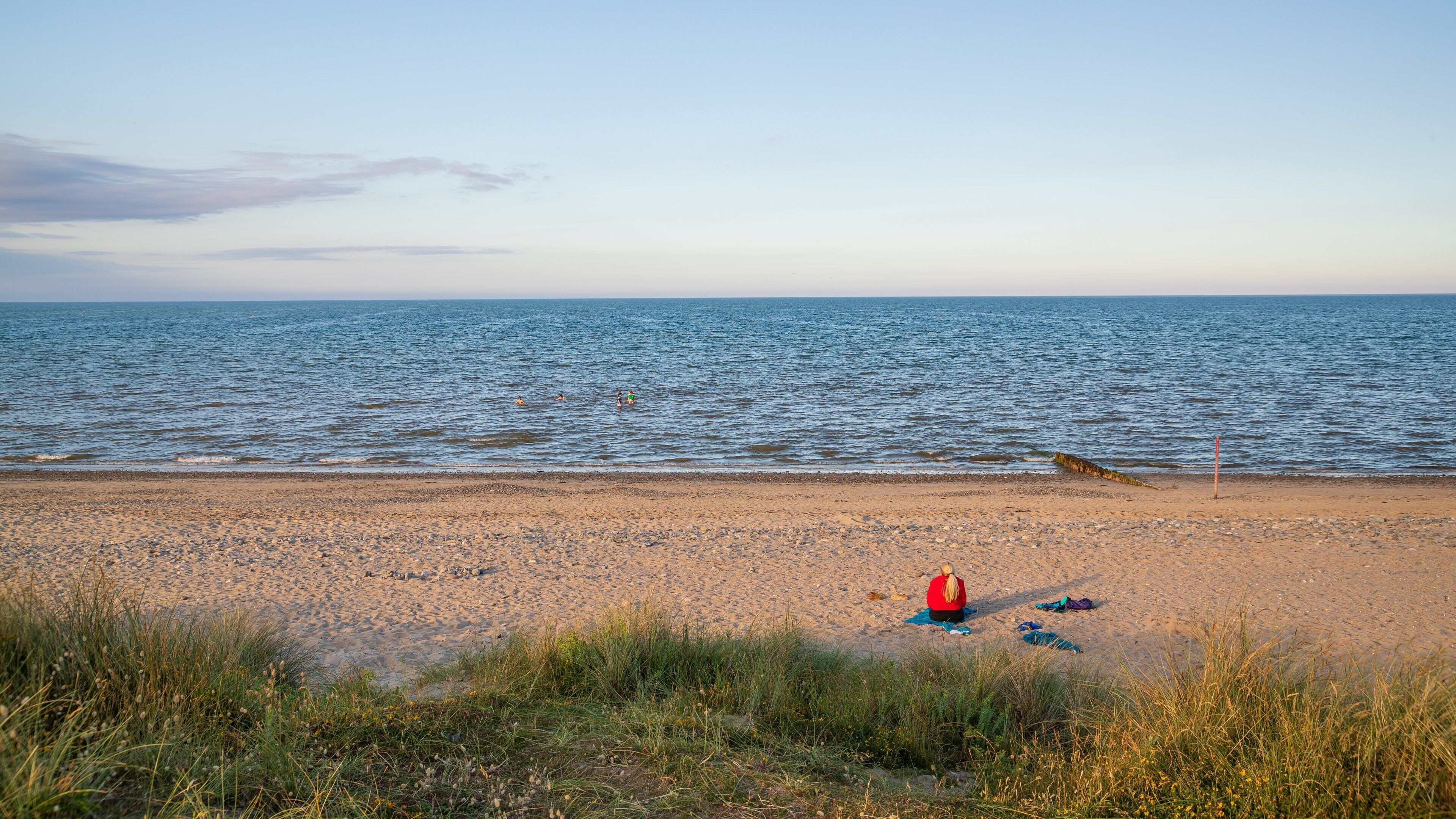 Rosslare Beach featuring a beach, general coastal views and a sunset