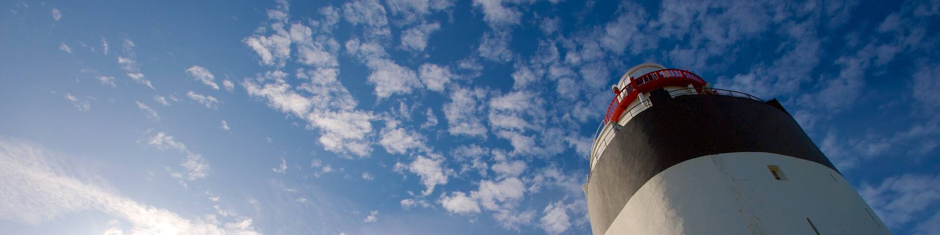 Ireland which includes a lighthouse and heritage architecture