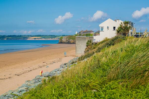 Duncannon Beach featuring a coastal town and a sandy beach