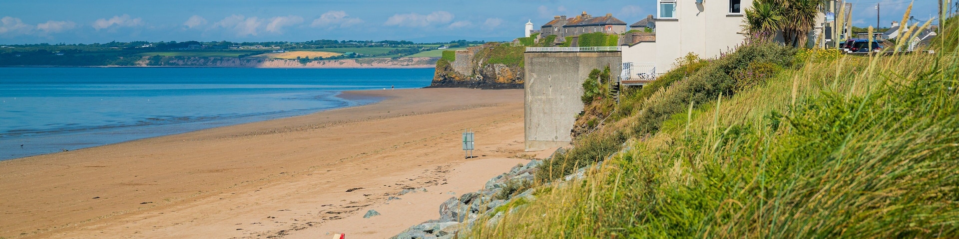 Duncannon Beach featuring a coastal town and a sandy beach