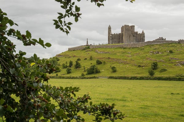 Rock of Cashel which includes mountains, a castle and heritage architecture