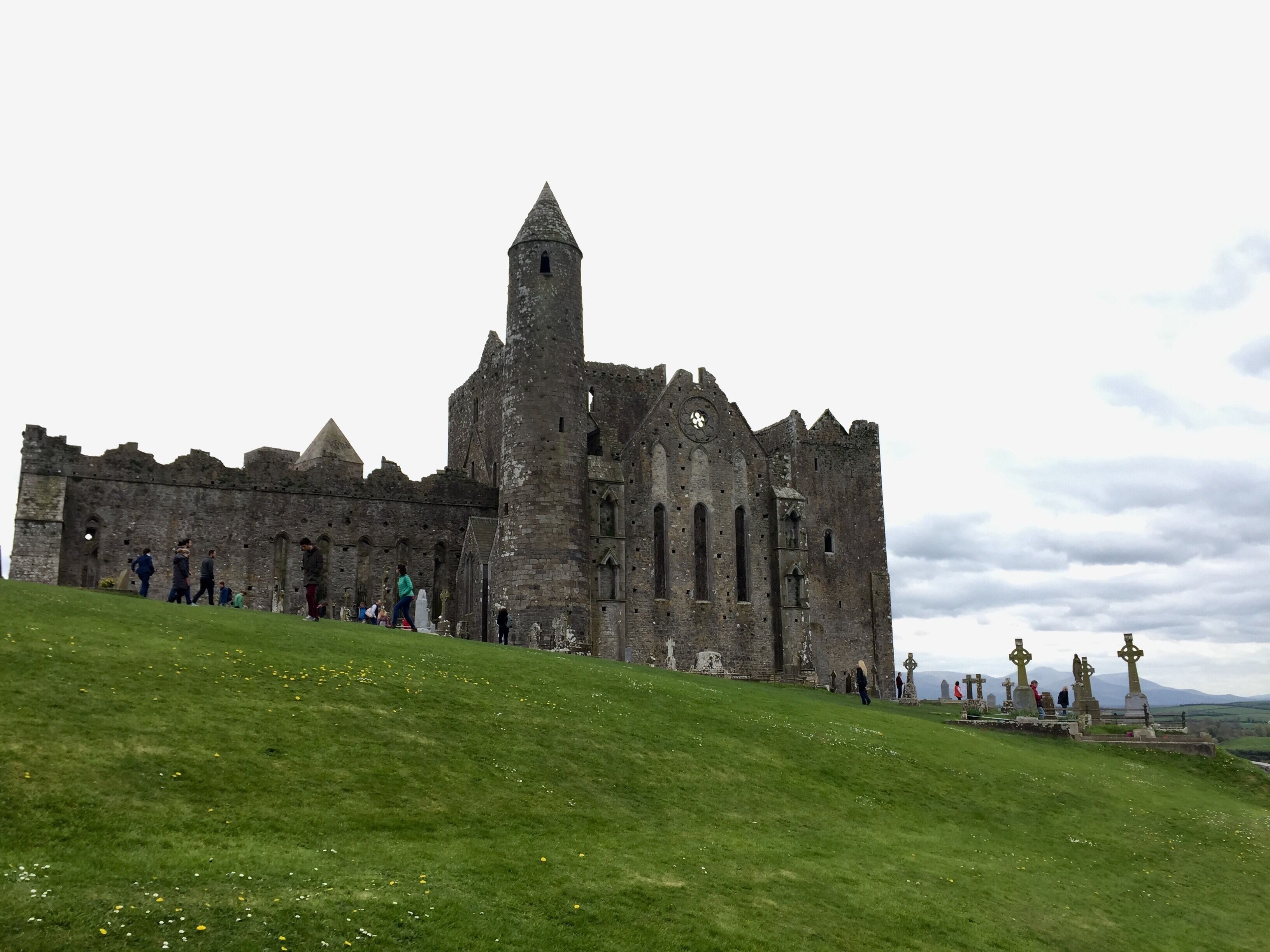 The Rock of Cashel is a formidable series of religious structures that overlooks County Tipperary in Ireland. The area holds significant religious and political history, as the ancient seat for the Kings of Munster it is said to be the site where St. Patrick baptized King Muirchertach Ua Briain. The oldest buildings date to the 12th century when the King donated the land to the Church. Overall the site houses a round tower, cathedral, chapel, and a graveyard featuring several iconic Celtic Crosses. This is one of my most favorite places in Ireland, with it being a quick and convenient bus trip from Dublin it should be a quintessential stop for any Irish travels!
#Ireland #History