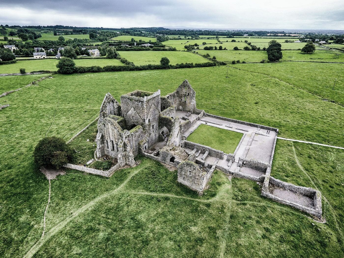 This is Hore Abbey by drone. Hore Abbey is located within walking distance of the Rock of Cashel. The Rock of Cashel is one of Ireland's must-see sights but we preferred Hore Abbey. It's much less crowded, making it fun to explore, especially if you are traveling with children. 

Read more about Hore Abbey:  http://www.earthtrekkers.com/hore-abbey-photos-drone-video/