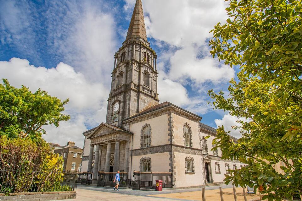 A historic church with a tall steeple and a clock tower.