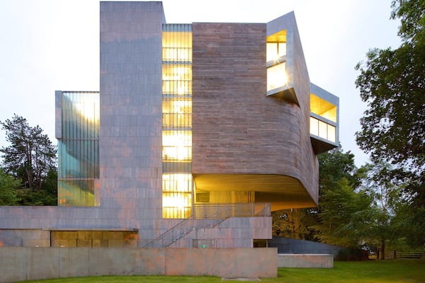 A modern building with a curved facade and large windows.