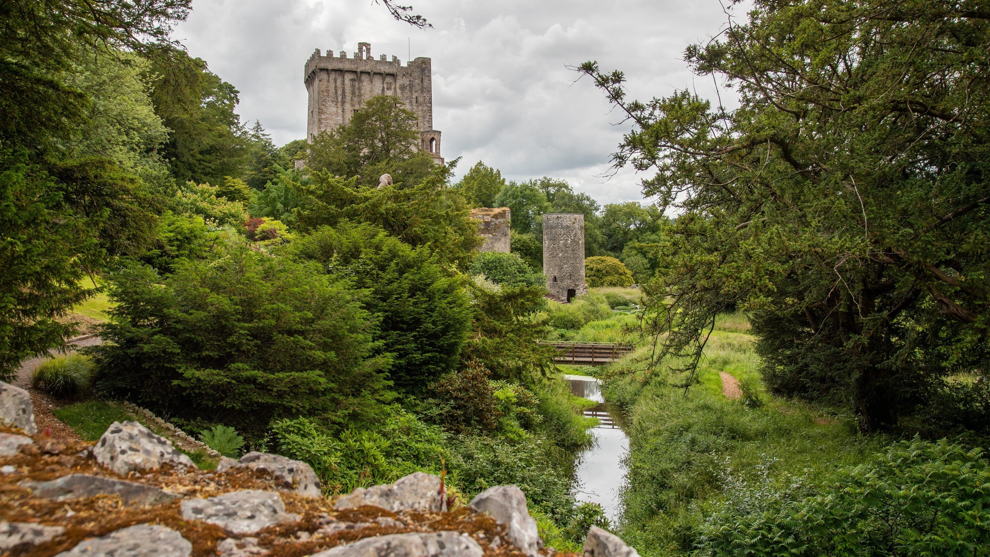 Blarney Castle which includes a river or creek, heritage elements and a ruin