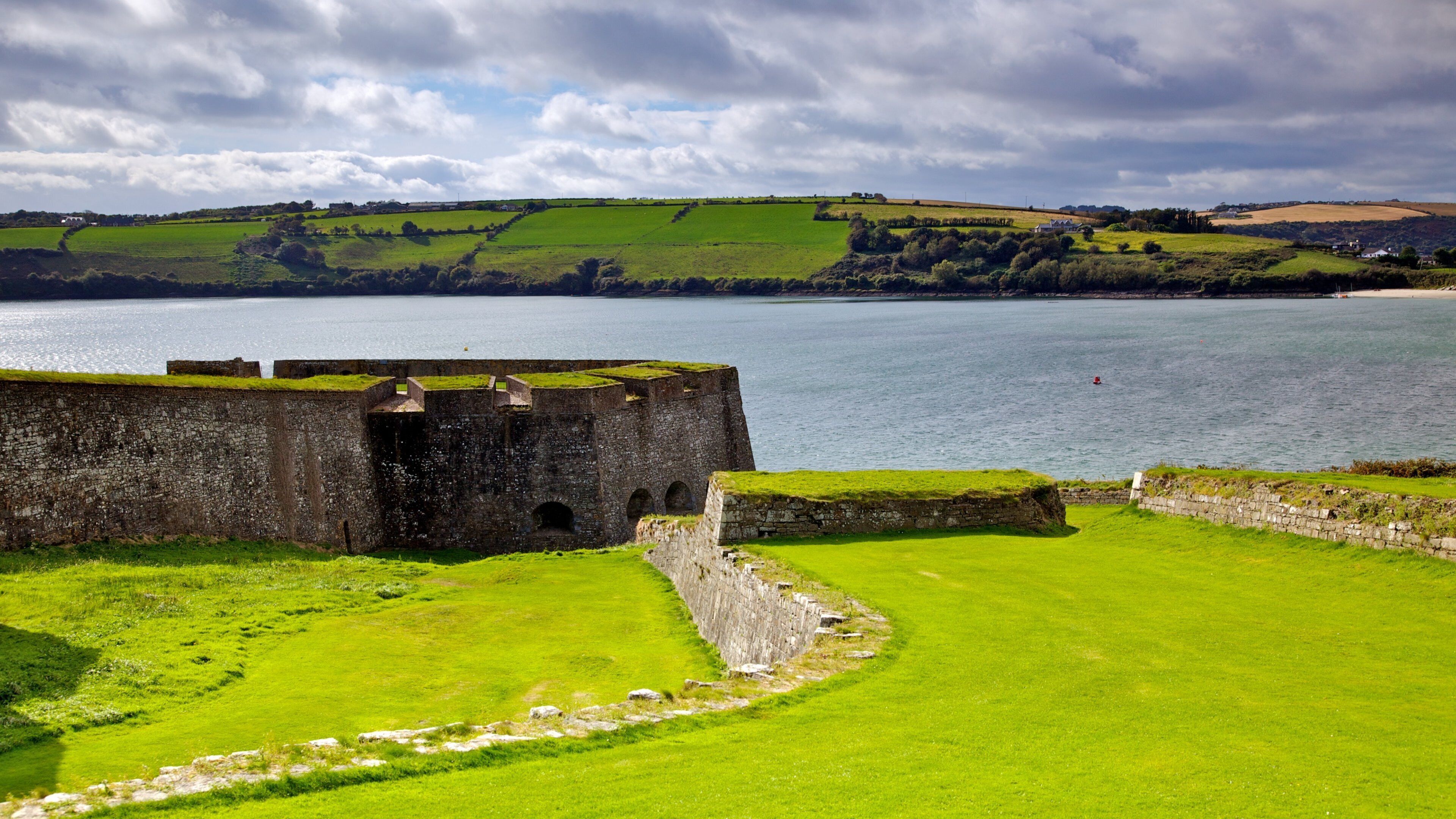 Charles Fort featuring general coastal views, heritage architecture and a castle