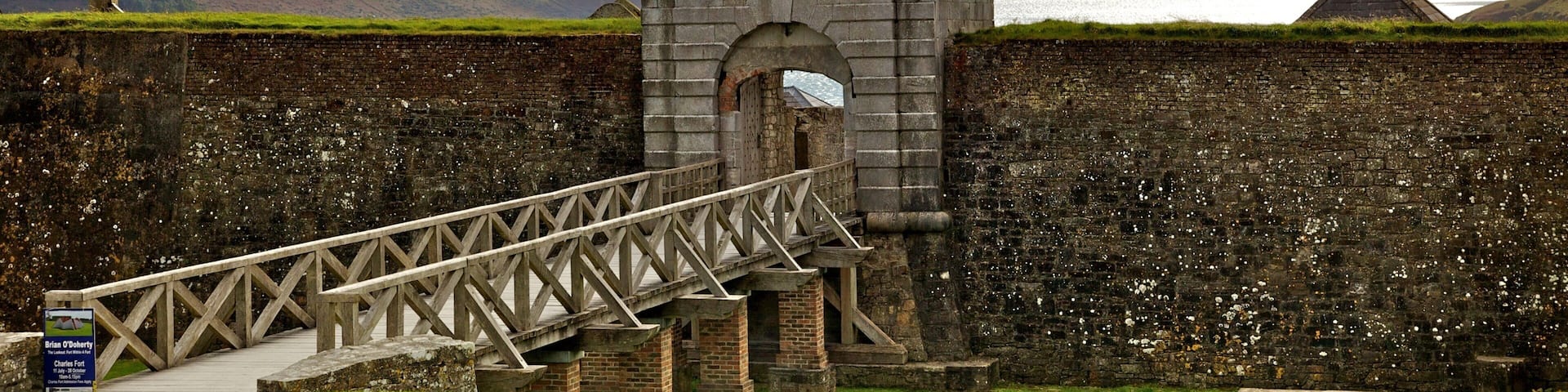 Charles Fort which includes a bridge, tranquil scenes and heritage architecture