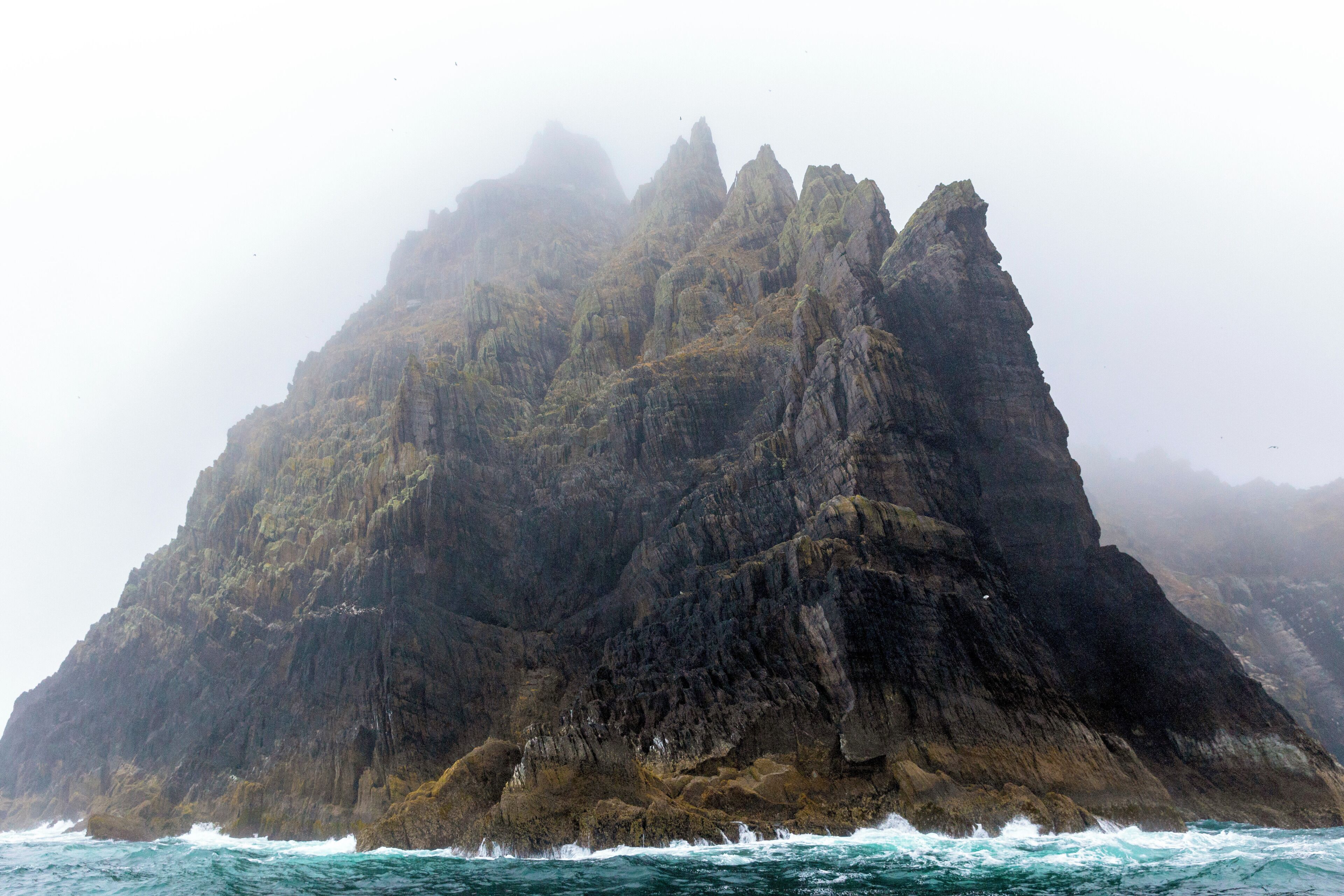 A view of Skellig Michael off the southern coast of Ireland, made famous recently as a filming location in the newest Star Wars trilogy. This sea crag rises 700 feet above the Atlantic and is swarming with puffins. At the top is a series of monastic beehive huts. The island is only accessible by boat during summer months. If you want to do a boat landing to explore the island, be sure to book your tour several months in advance, as it sells out quickly. It's a place to bring a picnic and explore the #GreatOutdoors. 