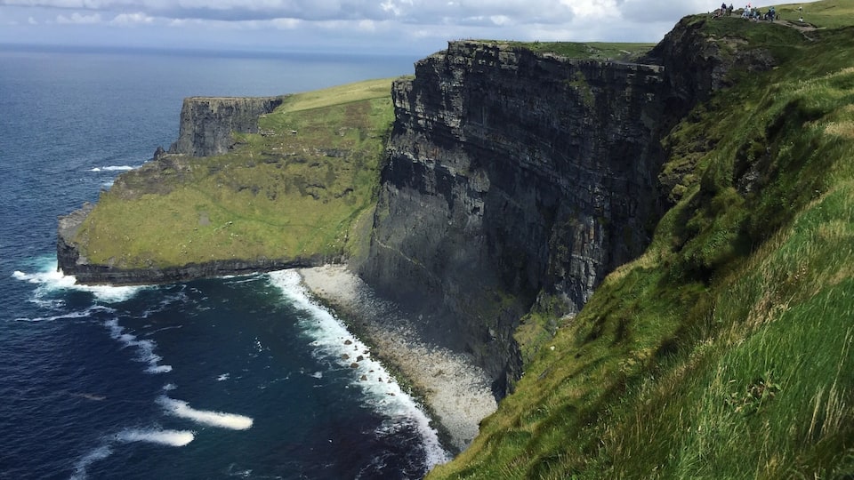 The Cliffs of Moher rising from the Atlantic Ocean on the western coastline of Ireland.