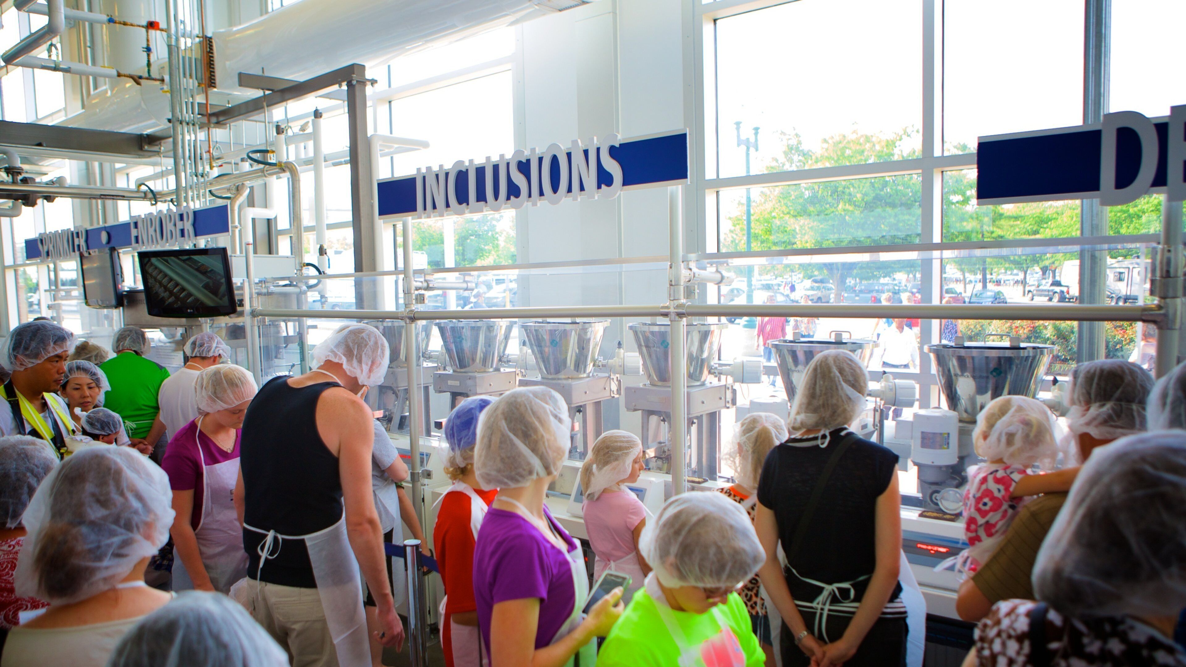 Hershey\'s Chocolate World which includes interior views and signage as well as a large group of people