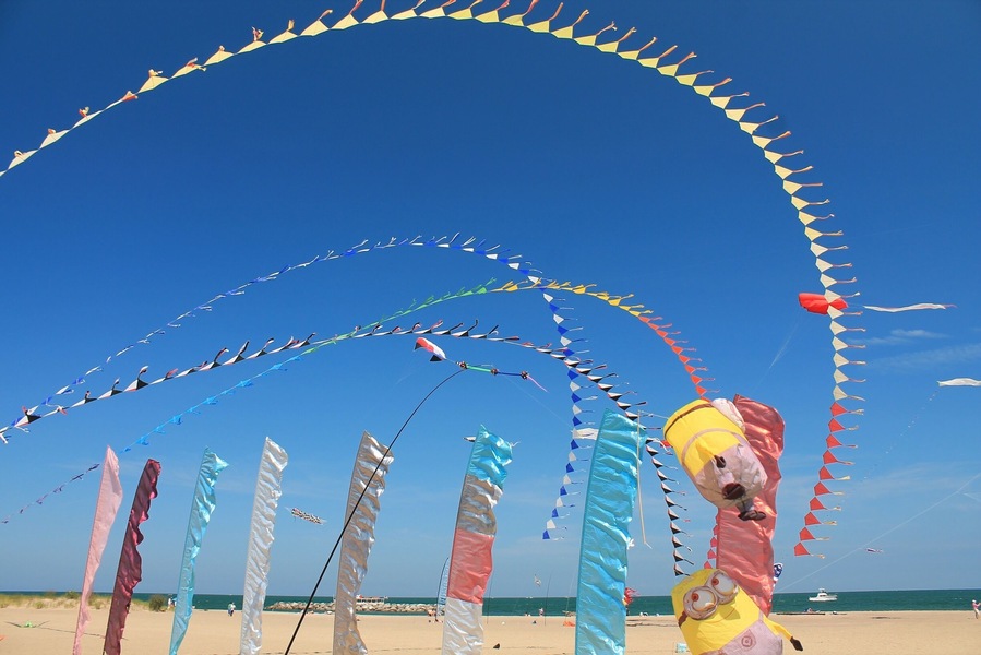 Flags flying in the wind at Lake Erie shore. #colorful #blue #waterlust #EndlessSummer #AquaTrove