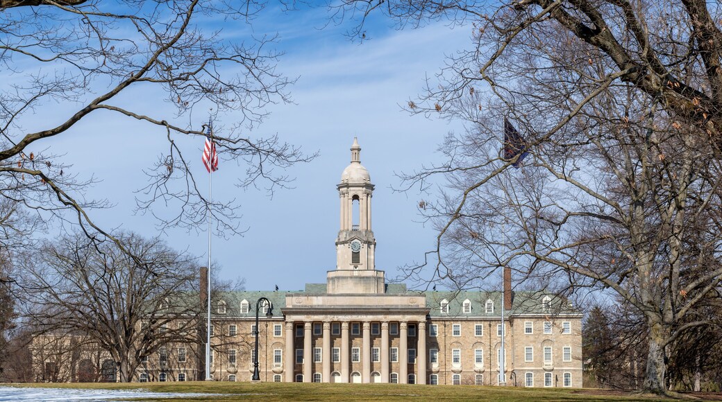 The Old Main building on the campus of Penn State University in spring sunny day, State College, Pennsylvania.
